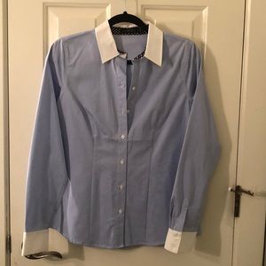 The limited light blue and white button up